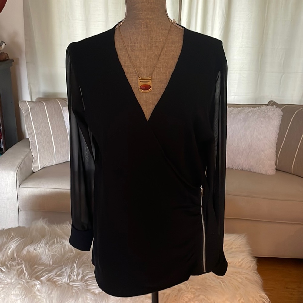 Venus black shirt with sheer long sleeves. No tags but never worn.